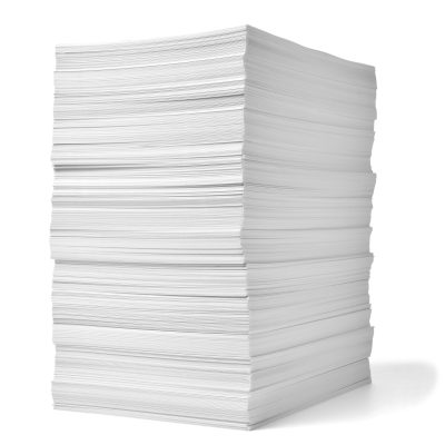 Close,Up,Of,A,Stack,Of,Paper,On,White,Background